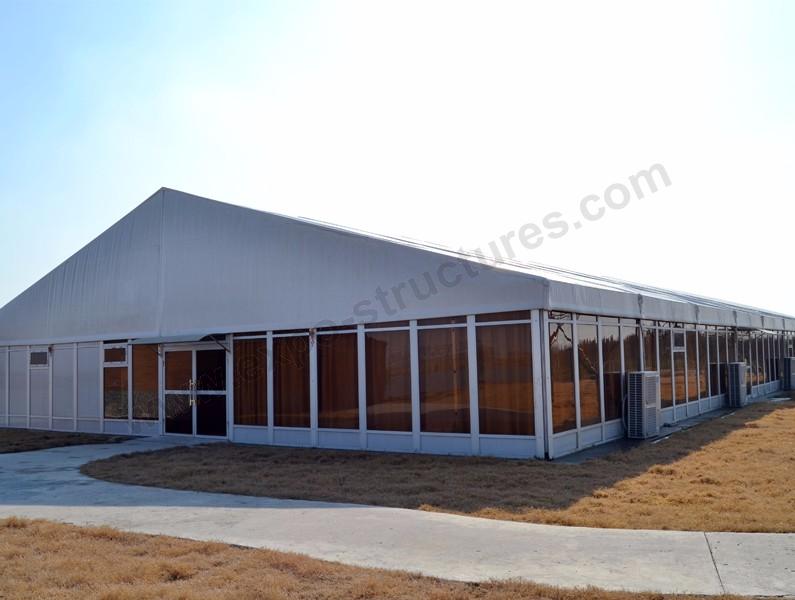 Outdoor marquee tent with glass panel wall